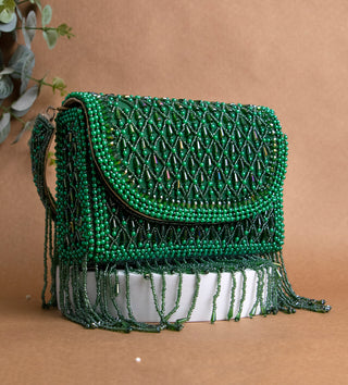 dark green handbag with pearls and tassels#color_dark-green