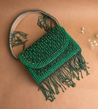 dark green handbag with pearls and tassels#color_dark-green