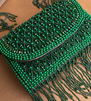 dark green handbag with pearls and tassels#color_dark-green