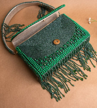 dark green handbag with pearls and tassels#color_dark-green