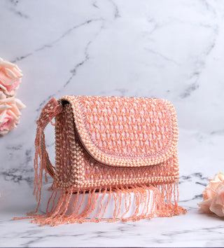 light pink handbag with pearls and tassels#color_light-pink