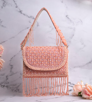 light pink handbag with pearls and tassels#color_light-pink