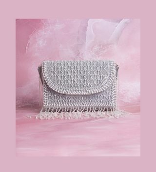 white handbag with pearls and tassels#color_white