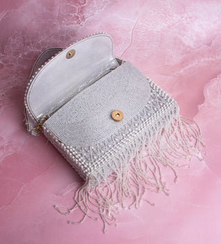 white handbag with pearls and tassels#color_white