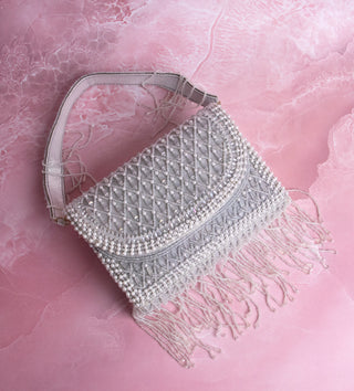 white handbag with pearls and tassels#color_white