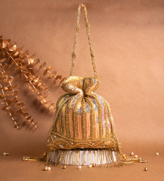 glamorous golden potli bag with tassels and pearls#color_gold