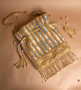 glamorous golden potli bag with tassels and pearls#color_gold