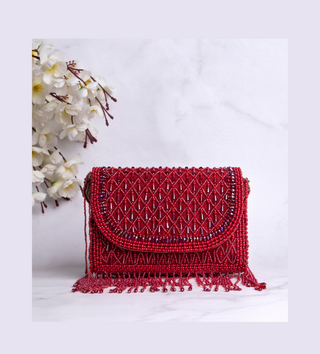 red handbag with pearls and tassels#color_red