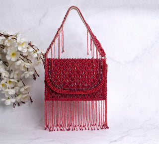 red handbag with pearls and tassels#color_red